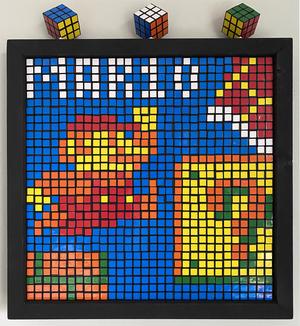 Rubik's cubes as pixel art of Super Mario jumping up to a question block