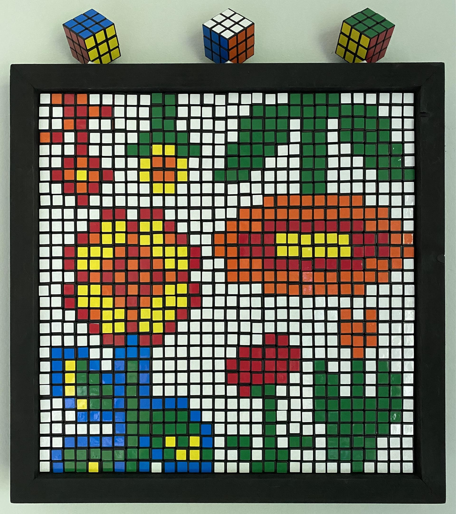 Rubik's cubes as pixel art of 6 flowers from Super Mario Bros, Minecraft, Terraria, and Stardew Valley.
