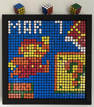 Partially built Rubik's cubes as pixel art of Super Mario jumping up to a question block for Mar 07